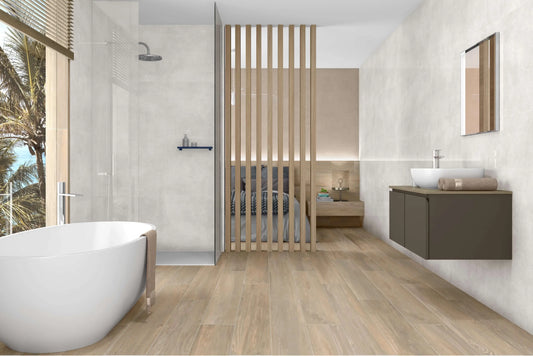 Porcelain Light Marble Tiled Walls, Oak Porcelain Effect Floor Tiles, Free Standing Bath, and Wall Hung Vanity Unite in a modern Bathroom 