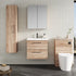 Bathroom setup with wooden cabinets, a sink, and a toilet against a tiled wall.