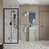 Modern bathroom with terrazzo flooring, shower, sink, and toilet.