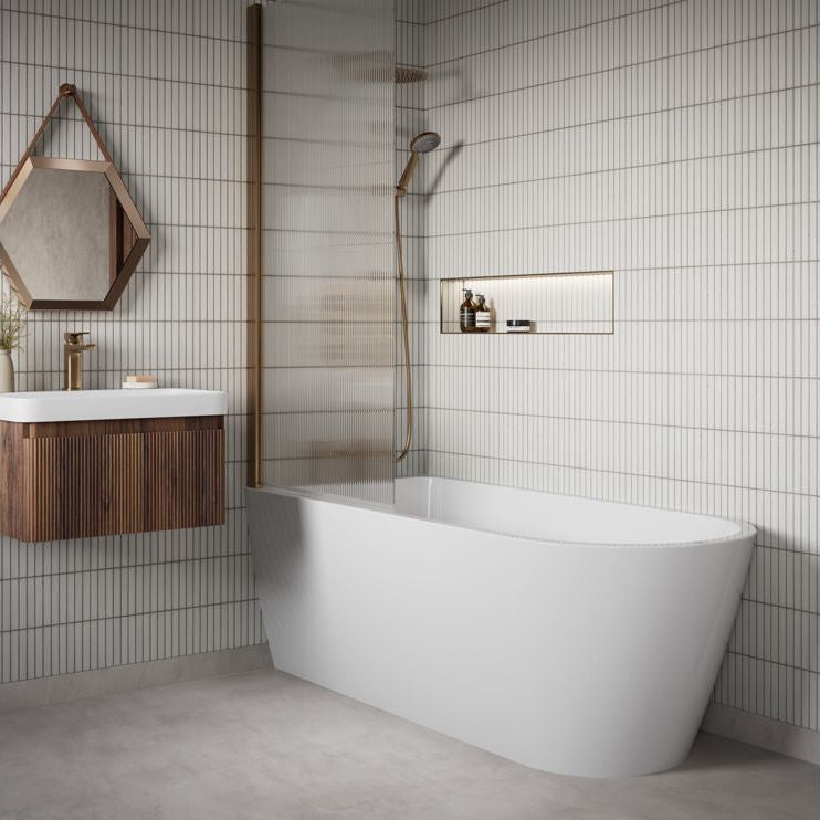 Modern bathroom with freestanding bathtub, walnut fluted wooden vanity, and tiled walls.
