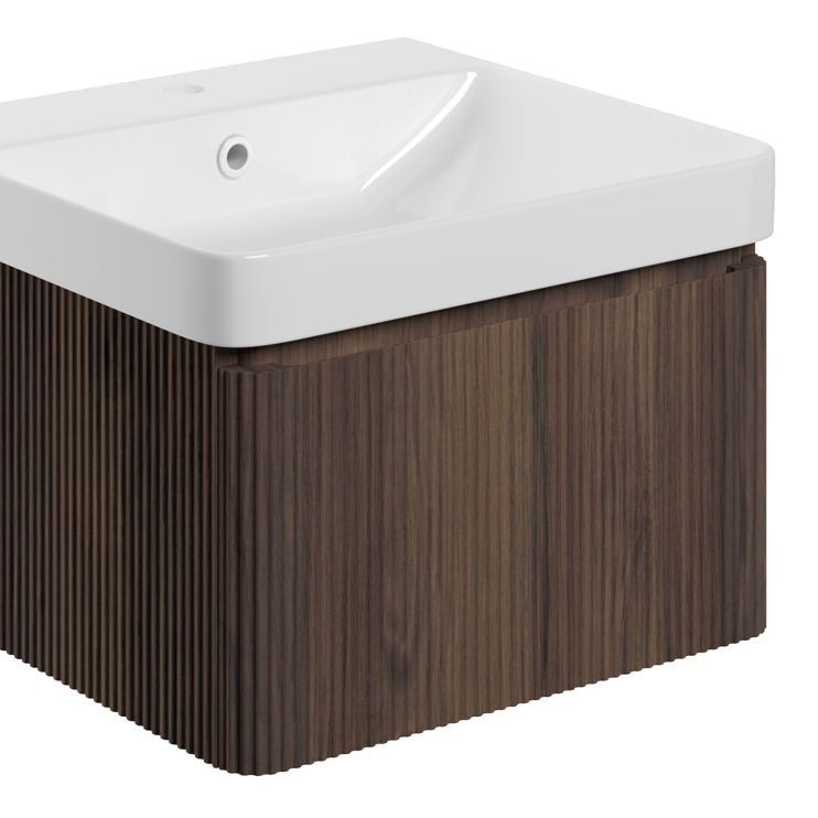 Textured walnut wall hung basin unit. Bathroom vanity unit with white ceramic sink on a white background
