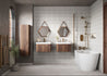 Modern bathroom with wooden vanity, hexagonal mirrors, and a freestanding bathtub.