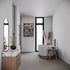 Modern bathroom with freestanding bathtub, vanity, and decorative elements.