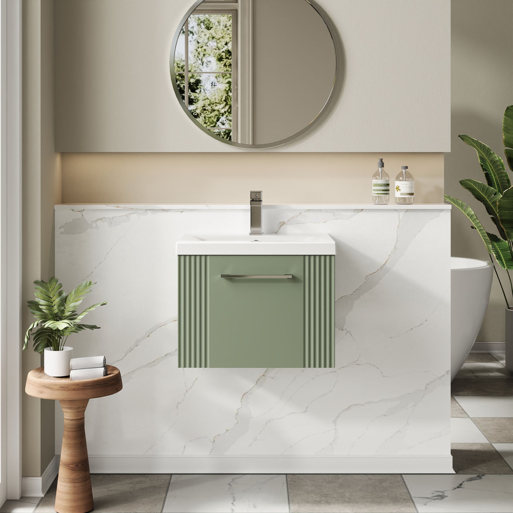 Bathroom interior with a green vanity unit, round mirror, and decorative elements.