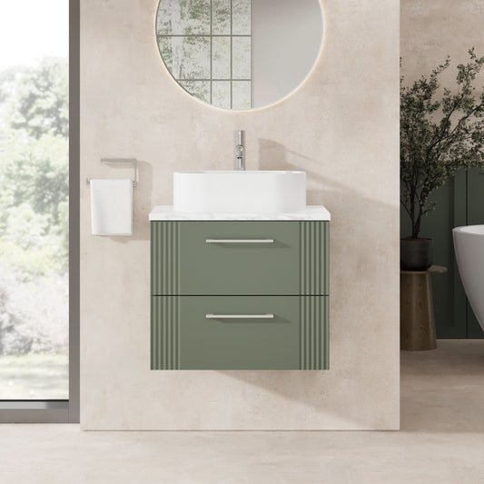 Bathroom vanity with green cabinet and white countertop in a modern bathroom setting.