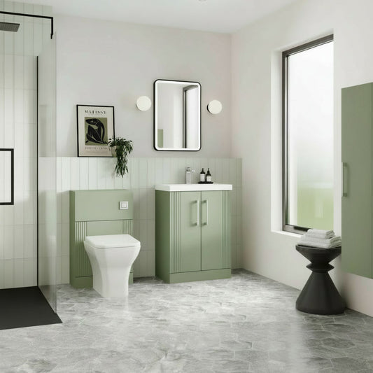Modern bathroom with green vanity unit, white toilet, and large window.