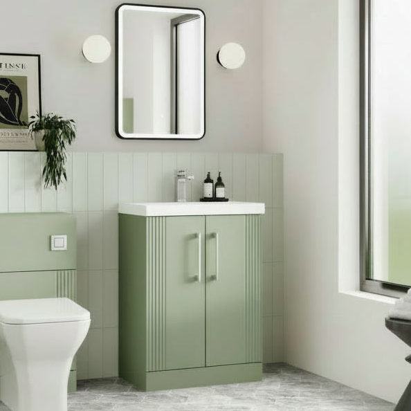 Modern bathroom with green vanity unit, white toilet, and large window.