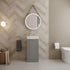 Modern bathroom with a chevron patterned wall, sink, mirror, and toilet.