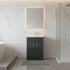 Modern bathroom with freestanding bathtub, black basin cabinet, and shower area.