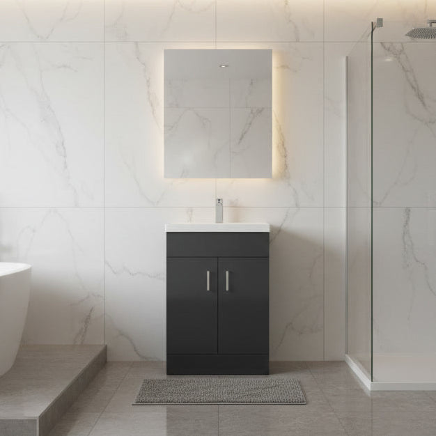 Modern bathroom with freestanding bathtub, black basin cabinet, and shower area.