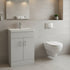 Modern bathroom with a white vanity unit and wall-mounted toilet.