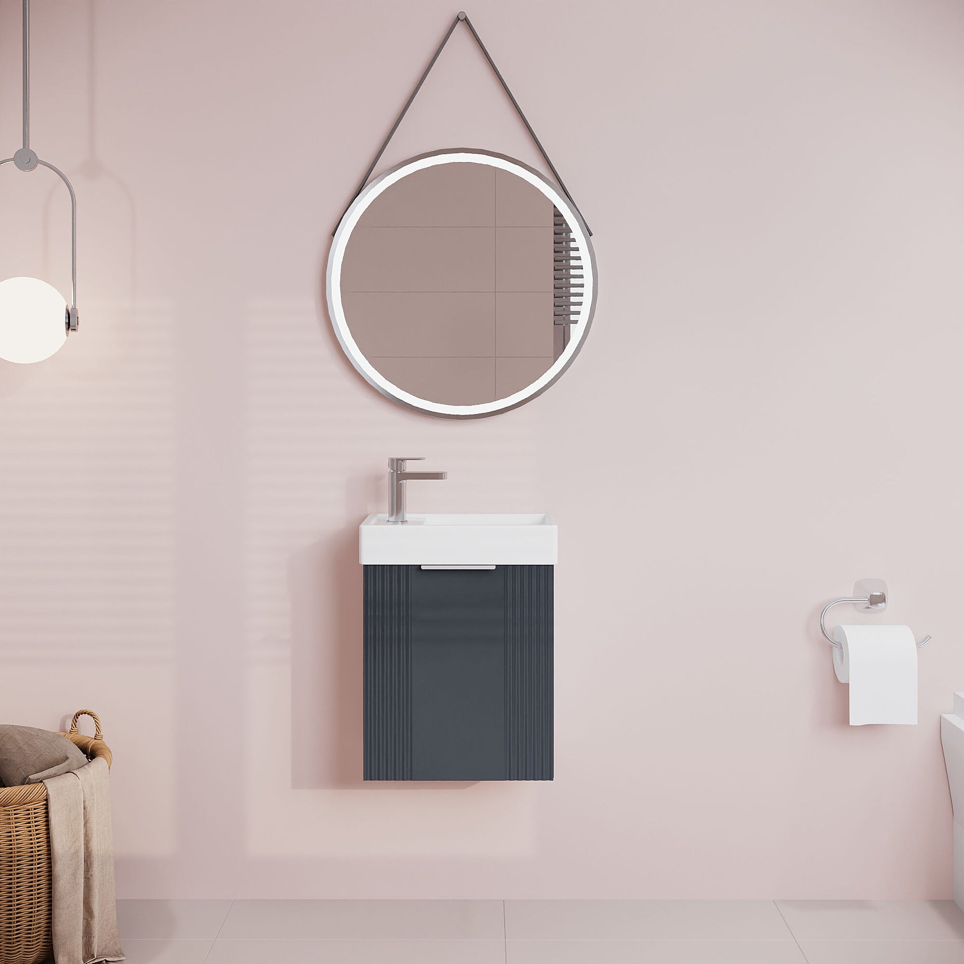 Bathroom with round mirror and dark vanity unit against a pink wall