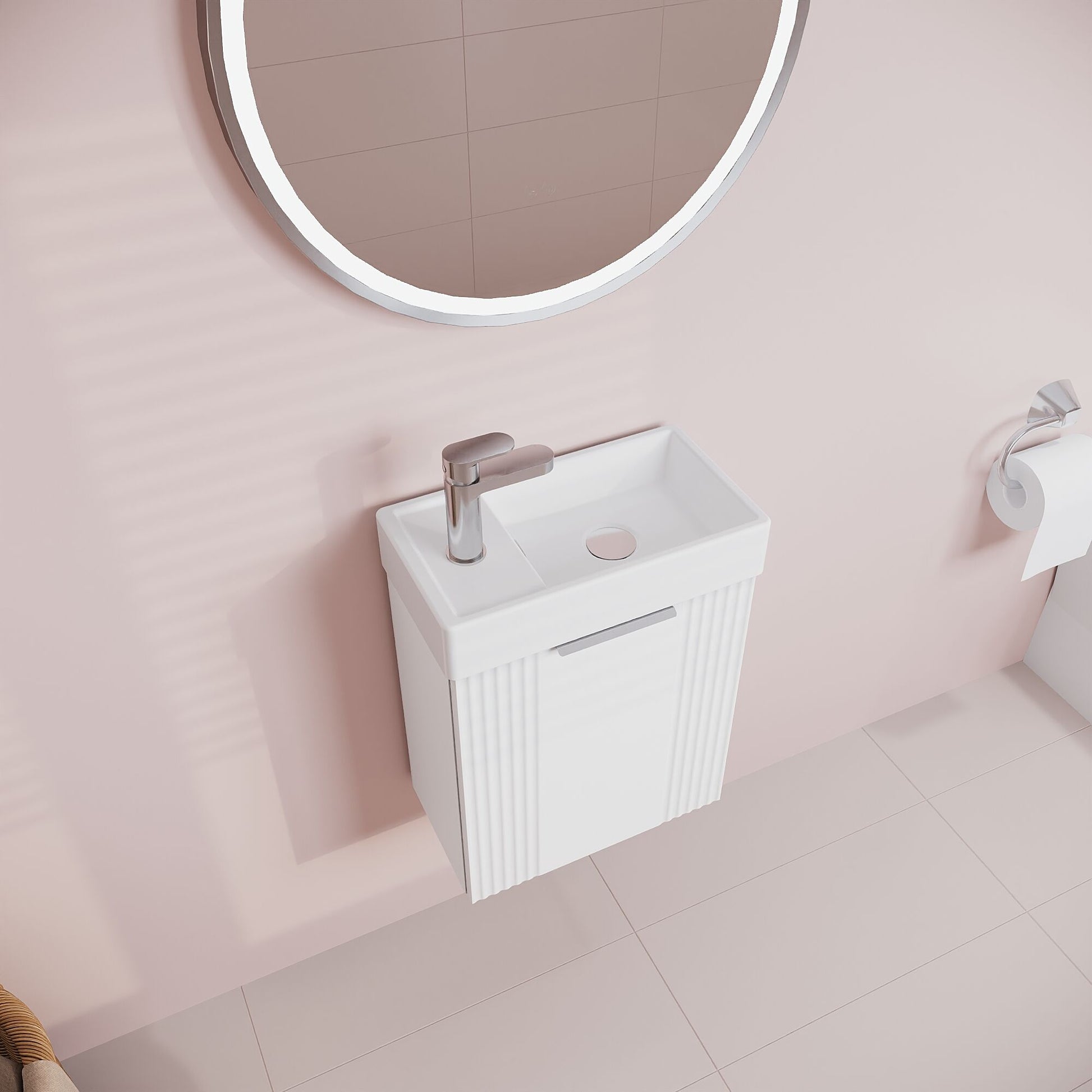 Bathroom setup with a white vanity unit, sink, and round mirror on a pink wall.