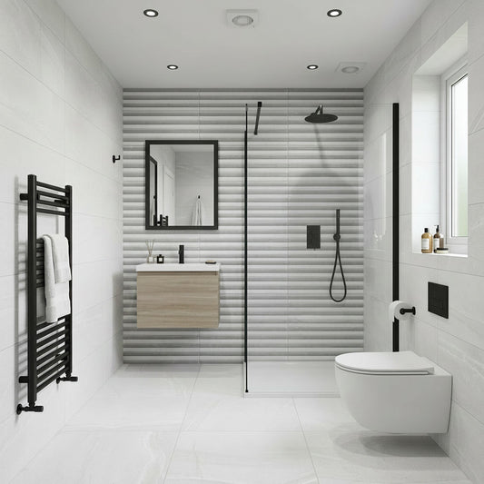 Modern bathroom with shower enclosure, sink, and toilet.