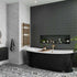 Modern bathroom with black freestanding bathtub, gray tiled walls, and decorative elements. Multipanel Monument Grey Metro Tile Effect Wet Wall Shower Panel