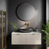 Bathroom with round mirror, sink, and gold towel rack on a dark wall. Multipanel Riven Slate Classic Wet Wall Shower Panel