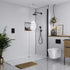 Modern bathroom with glass shower enclosure, toilet, and decorative elements. Multipanel White Grey Tile Effect Wet Wall Shower Panel