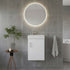 Modern bathroom with round illuminated mirror, white vanity, and gray tiles.
