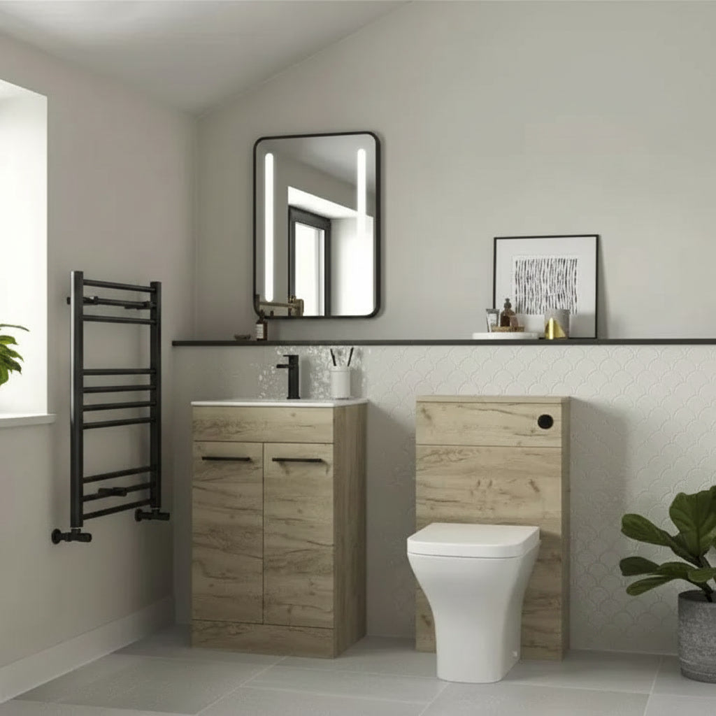 Bathroom interior with wooden vanity, toilet, and towel rack.