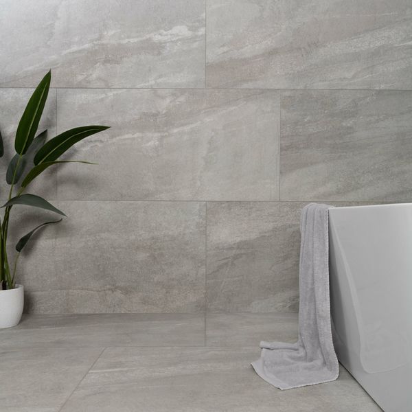 Astra grey matte stone-effect tiles, 1200x600mm, ideal for both floors and walls, crafted from porcelain, featuring perfect grey tones.