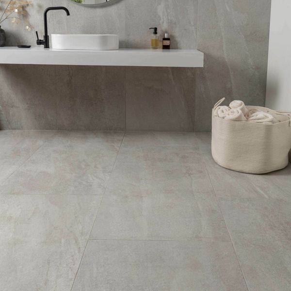 Astra Pearl matt stone-effect tiles, 1200x600mm, perfect for floors and walls. These porcelain tiles come in a sleek grey shade, ideal for a modern look.