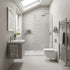 Modern bathroom with gray tiles, a shower, sink, and toilet.
