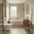Modern bathroom with a freestanding bathtub, sink, and toilet.