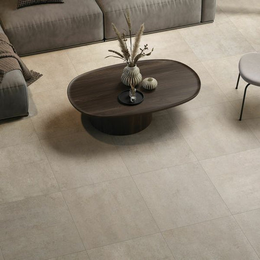 Wooden coffee table with decorative items on a beige stone tiled floor