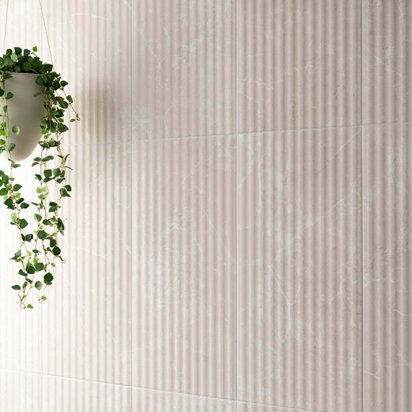 Beige textured wall tiles with a hanging plant on the left side