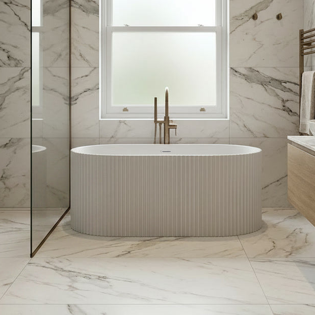 Modern bathroom with a freestanding bathtub, marble walls, and a window.