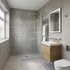 Modern bathroom with gray tiled walls, wooden vanity, and white fixtures.