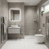 Modern bathroom with tiled walls, a sink, and toilet.