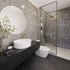 Modern bathroom with gray tiles, a white sink, and a glass shower enclosure.