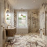 Modern bathroom with marble walls and floor, featuring a bathtub, sink, and shower.