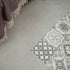 Atrium Lubeck Perla tiles, 600x600mm, suitable for floors and walls, made of porcelain, featuring a sleek grey finish.