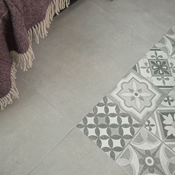 Atrium Lubeck Perla tiles, 600x600mm, suitable for floors and walls, made of porcelain, featuring a sleek grey finish.
