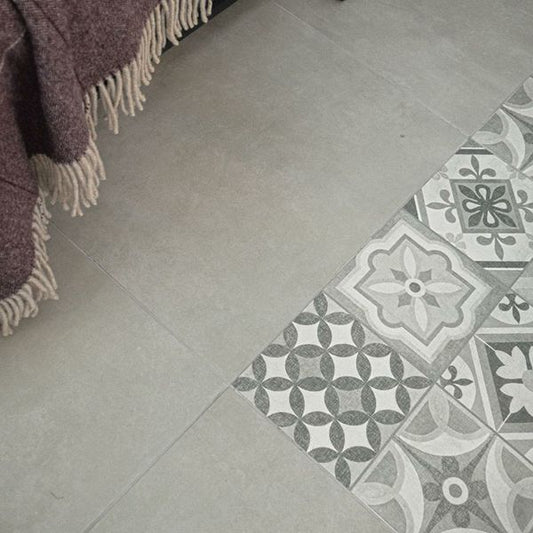 Atrium Lubeck Perla tiles, 600x600mm, suitable for floors and walls, made of porcelain, featuring a sleek grey finish.